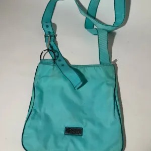 Blue Crossbody Bag with Adjustable Strap and Slouchy Design